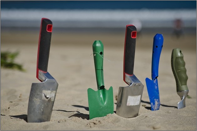 Image showing 5 different shovels for outside use.