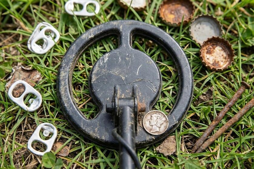 5-inch metal detector coil detecting among pull tabs and trash targets in urban park